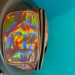 Holographic fanny pack , has 3 departments, it has a good amount of space.